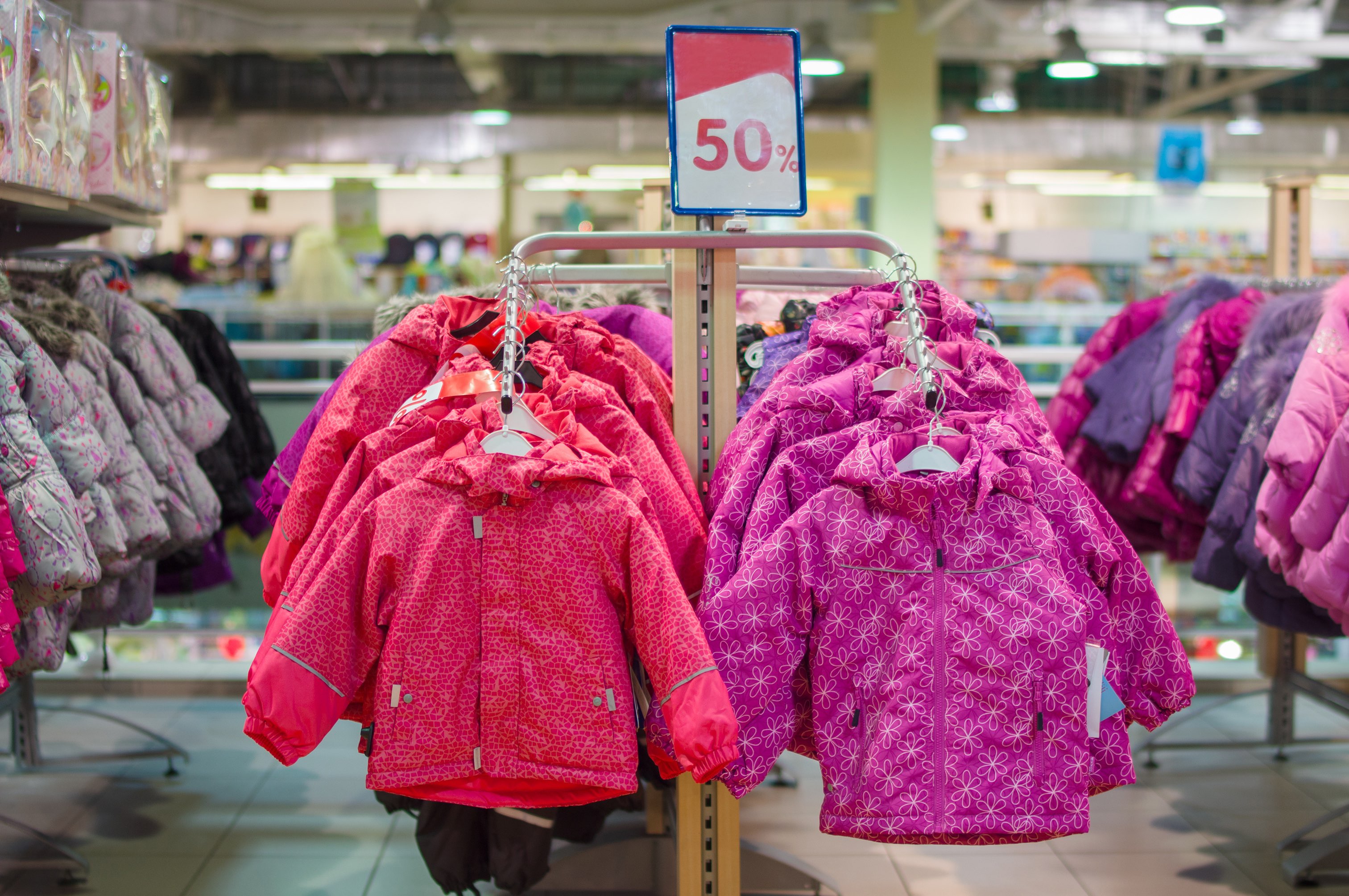 Winter jackets for kids on stands in store store ready for winter Store ready for winter